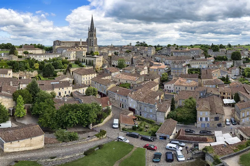 Saint-Émilion from the vineyards — the village every right-bank tour walks